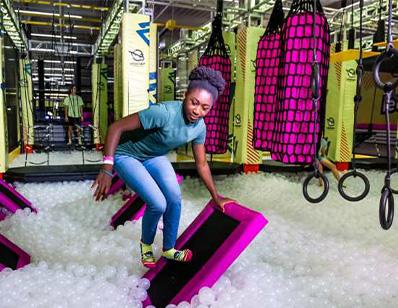 a girl doing a challenge course