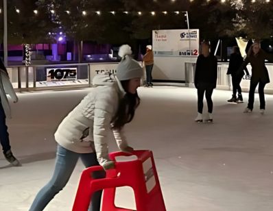 girls enjoying skating on the outdoor rink downtown Greensboro