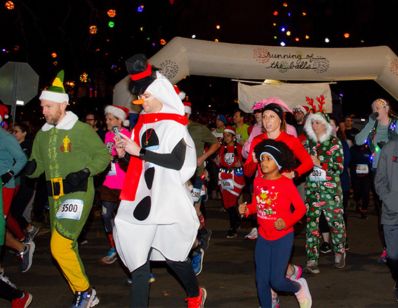 runners decked out in holiday outfits running