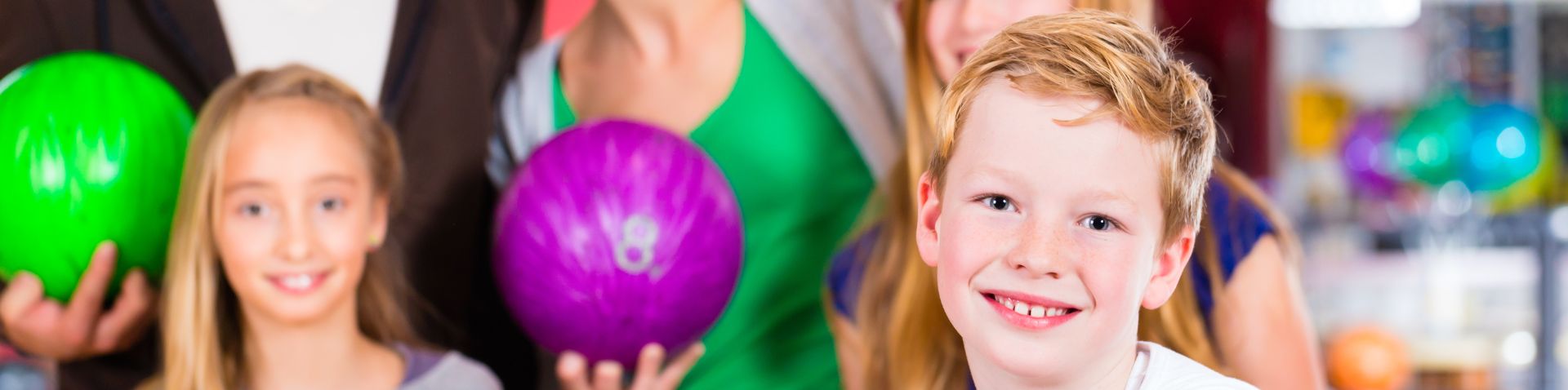 a family bowling together