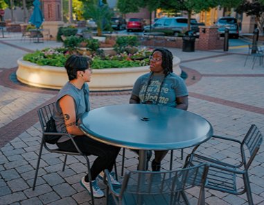 Two people sitting at a table