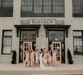 bridal party in front of building