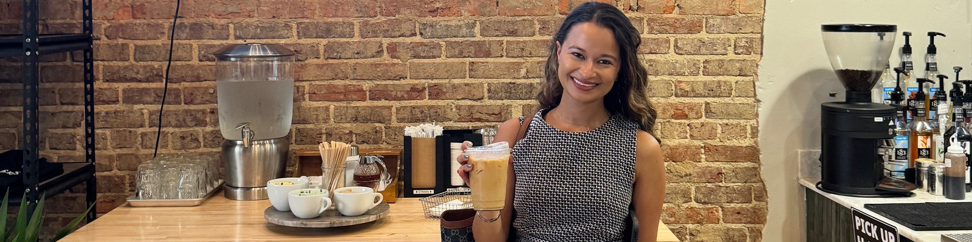 Taylor holding her iced coffee 