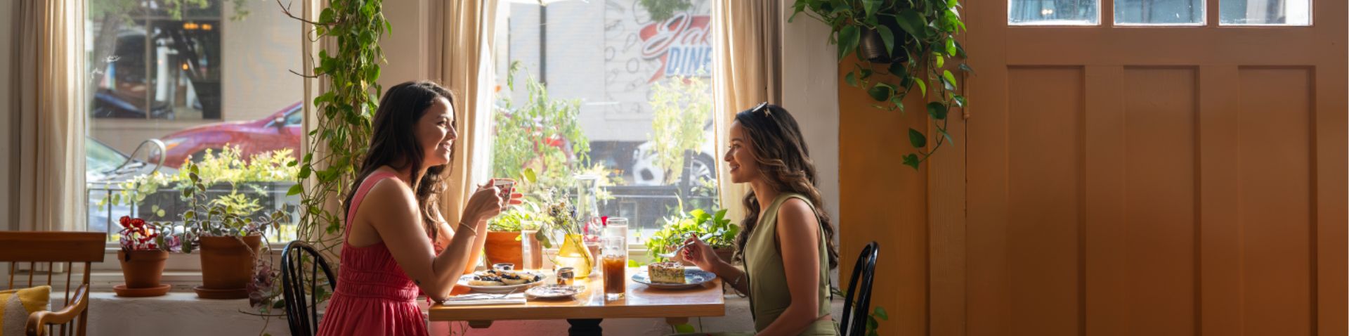 two women enjoying brunch at Chez Genese