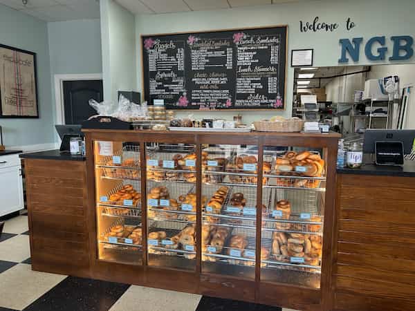 bagel counter with menu, coffee behind