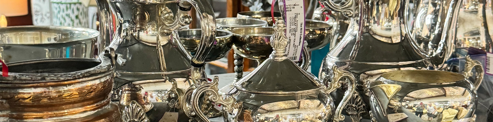 shelf of fine silver dishes