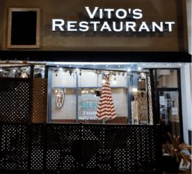 restaurant exterior showing outdoor patio with accent lighting