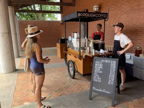 the coffee stand in front of the entrance to the museum