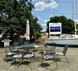 patio area with bar sign in the background