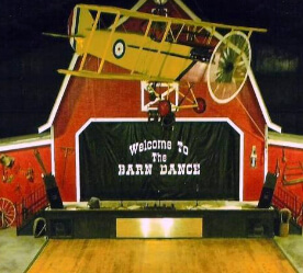 a barn with a stage in front