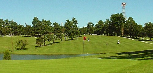 golf course with water and trees