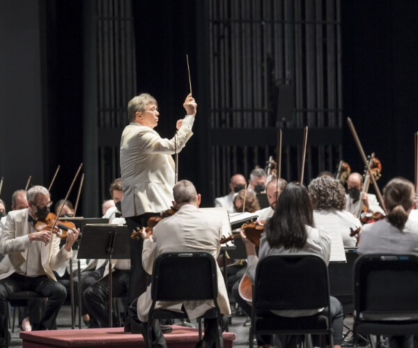 conducting an orchestra