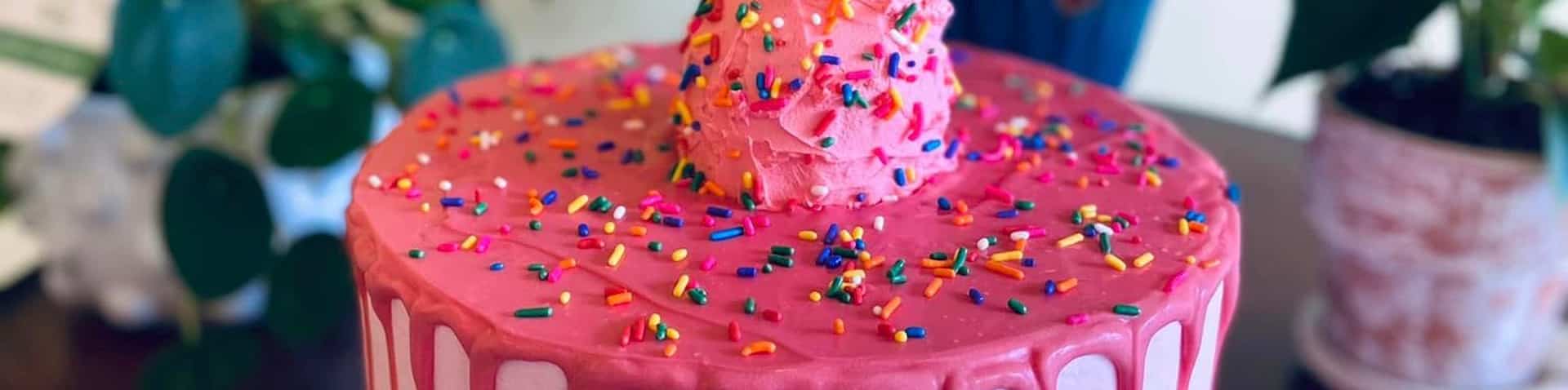 pink cake with ice cream decorations