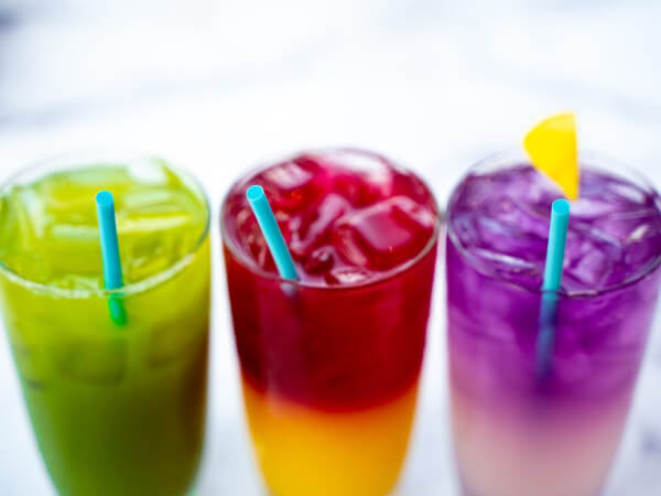 three colorful drinks