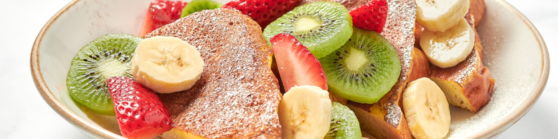 french toast with kiwis, bananas and strawberries