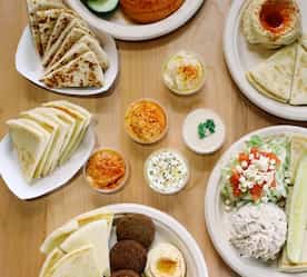 assortment of plates of food offered