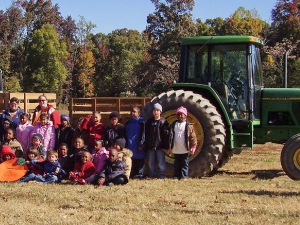 Kids in front of tractor