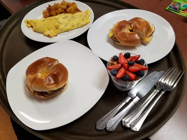 Breakfast sandwiches and fruit
