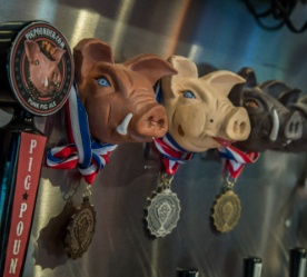 Pig heads with medallions