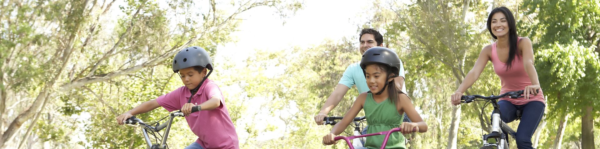 a family biking on the greenway