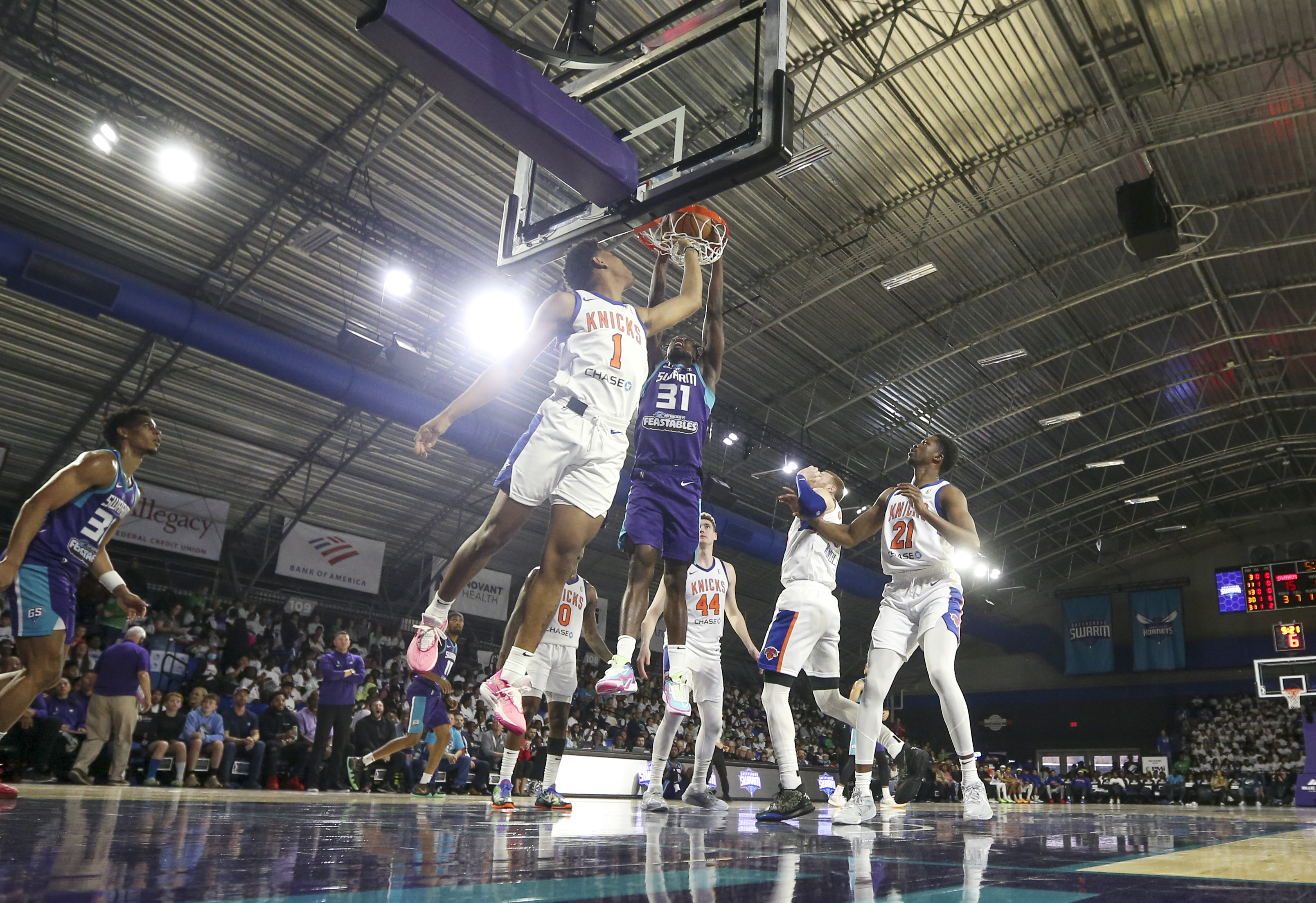 Two basketball teams playing against eachother